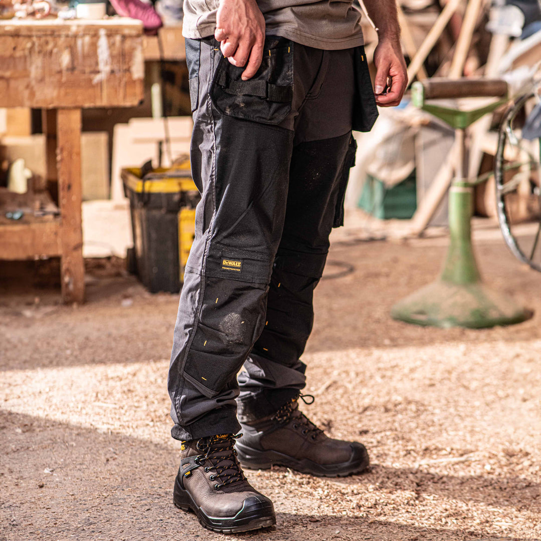 Duluth fire hose work pants for carpenters with abrasion resistant fabric and durability