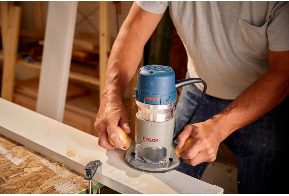 Bosch 1617EVSPK router with both plunge and fixed bases on bench